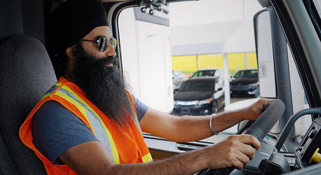 Truck Driver Seated in Cab of truck