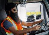 Truck Driver Seated in Cab of truck