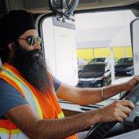 Truck Driver Seated in Cab of truck