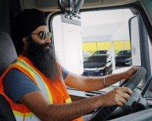 Truck Driver Seated in Cab of truck