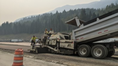 Highway workers with dumptruck